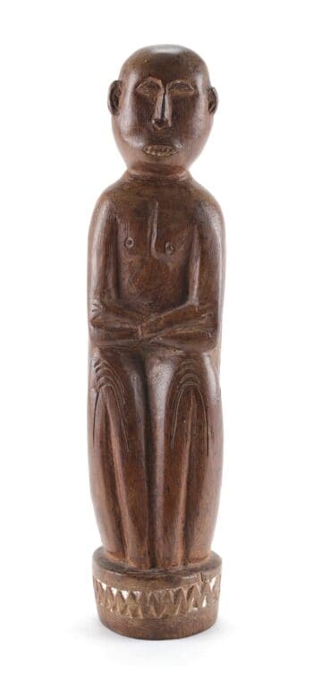 Massim statue - seated human figure - Trobriand Islands - detail photo